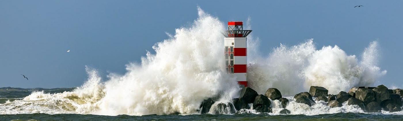 Lighthouse in IJmuiden, Netherlands, struck by waves from Storm Dudley in February 2022
