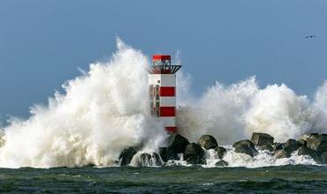 Lighthouse in IJmuiden, Netherlands, struck by waves from Storm Dudley in February 2022